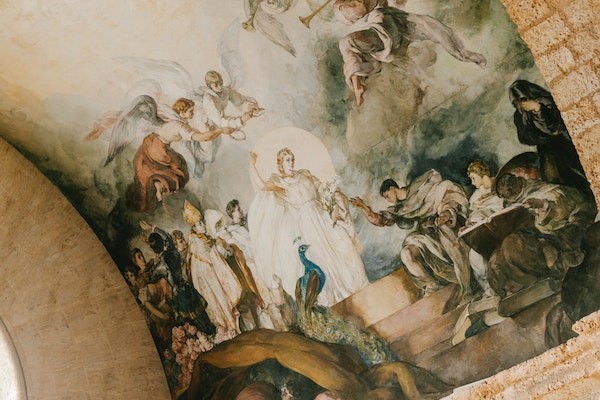 Art history on arched ceiling of Jesuit temple