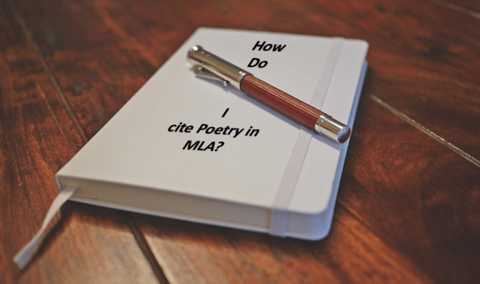 Notebook with cover written ‘how do I cite poetry in MLA?’ placed on wooden surface 
